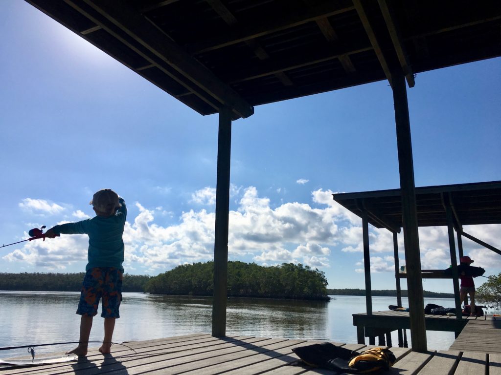 fishing from the dock in the everglades park in florida with children